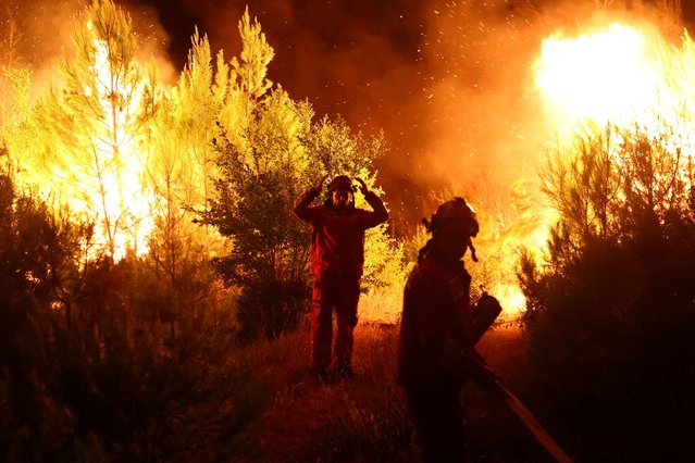 Members of emergency services work to contain a wildfire in Shengjin, Albania, on July 30, 2024. (Photo by Florion Goga/Reuters)