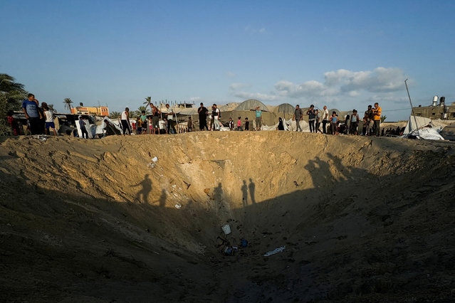 People inspect the site following Israeli strikes on a tent camp sheltering displaced people, amid the Israel-Hamas conflict, at the Al-Mawasi area in Khan Younis, in the southern Gaza Strip on September 10, 2024. (Photo by Mohammed Salem/Reuters)