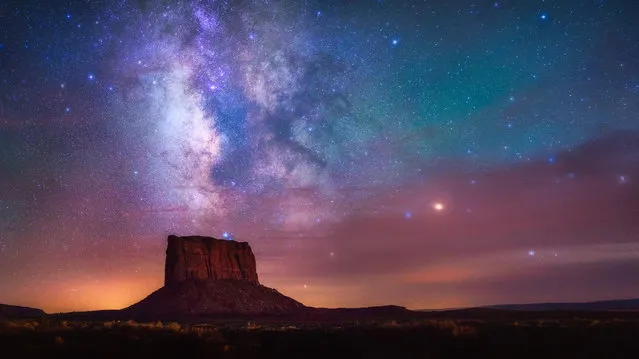 Monument Stars, Monument Valley, US. Despite being taken during the lunar eclipse of 2015, Albert Dros actually didn’t shoot the moon but took the opportunity to capture the amazing dark sky. Coming from a country (the Netherlands) with so much light pollution, this marked the first time the photographer had seen the Milky Way so clearly. The red glow in the sky is from the extraordinary atmosphere during the lunar eclipse – an experience Dros said he would never forget. This shot is a panorama comprised of three vertical shots. (Photo by Albert Dros/National Maritime Museum)