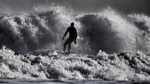 A surfer in action at Tynemouth on the North East coast of England on March 4, 2020. (Photo by Owen Humphreys/PA Images via Getty Images)