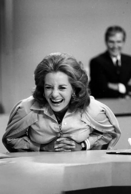 Television newswoman Barbara Walters, co-host of NBC's Today Show, shares a laugh with staff members in New York City, June 3, 1976. Today will be Walters' last live appearance on NBC as she joins ABC to become the rival networks' evening news anchorwoman. (Photo by AP Photo)
