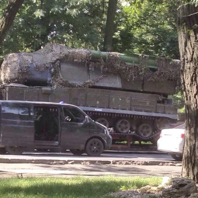 This photo from an anonymous source provided by the Dutch Public Prosecution's Office (OM) and Joint Criminal Investigation Team (JIT), shows a Buk-Telar missile launching system probably taken on July 17, 2014, in the town of Makeevka, Ukraine. The JIT presumes that the picture contains the BUK-Telar which is responsible for downing Malaysia Airlines Flight MH17. An international team investigating the downing of Malaysia Airlines Flight 17 over Ukraine in 2014 is appealing for information about the photograph that prosecutors believe features the Buk rocket that blew the passenger jet out of the sky, killing all 298 on board and Dutch National Prosecution Office spokeswoman Elsbeth Kleibeuker said Thursday October 19, 2017, that the photo of the missile was recently received by investigators via a website to which members of the public can anonymously post evidence. (Photo by Joint Criminal Investigation Team via AP Photo)