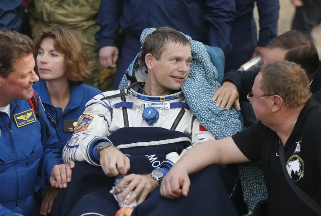 Denmark's astronaut Andreas Mogensen rests after landing near the town of Dzhezkazgan (Zhezkazgan), Kazakhstan, September 12, 2015. (Photo by Yuri Kochetkov/Reuters)