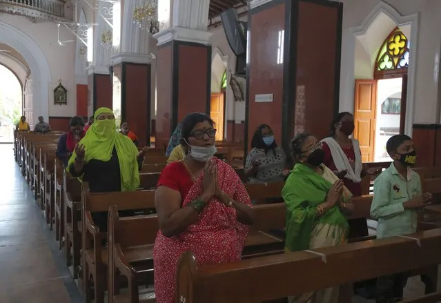 Christian devotees offer prayers at Saint Mary's Basilica opened after lockdown in Hyderabad, India, Tuesday, June 9, 2020. (Photo by Mahesh Kumar A./AP Photo)