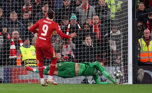 Gianluigi Donnarumma of Paris Saint-Germain saves a penalty from Darwin Nunez of Liverpool in the shootout during the UEFA Champions League 2024/25 Round of 16 Second Leg match between Liverpool FC and Paris Saint-Germain at Anfield on March 11, 2025 in Liverpool, England. (Photo by Julian Finney/Getty Images)