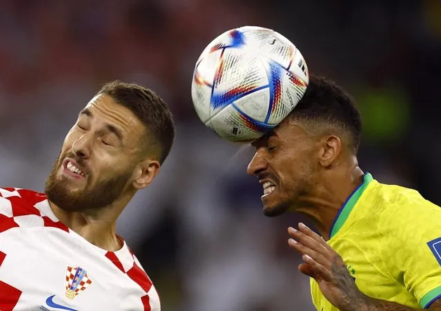 Nikola Vlasic of Croatia battles for possession with Danilo of Brazil during the FIFA World Cup Qatar 2022 quarter final match between Croatia and Brazil at Education City Stadium on December 09, 2022 in Al Rayyan, Qatar. (Photo by Suhaib Salem/Reuters)
