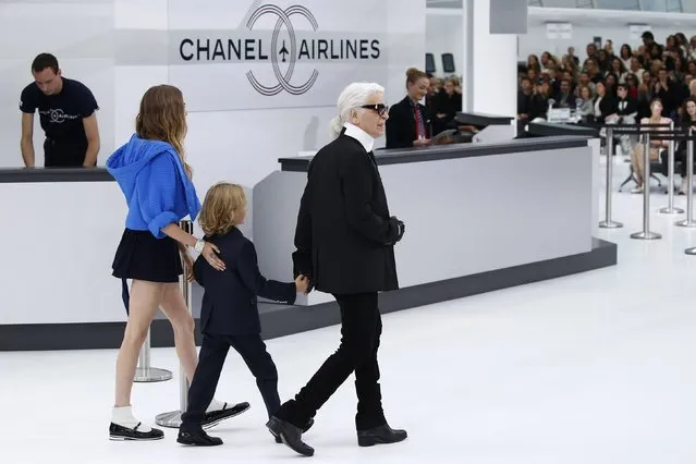 German designer Karl Lagerfeld (R) and model Cara Delevingne appear at the end of his Spring/Summer 2016 women's ready-to-wear collection for fashion house Chanel in Paris, France, October 6, 2015. (Photo by Benoit Tessier/Reuters)