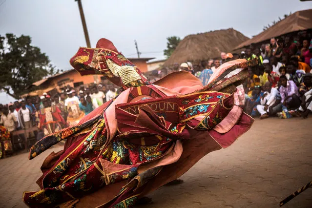 “Vodounsi” (voodoo followers) celebrate National Voodoo Day, Ouidah, Benin, 10 January 2018 (issued 11 January 2018). The people of Benin celebrated the National Voodoo Festival with guests from all over the world. Vodun is an ancient religion practiced by some 30 million people in the West African nations of Benin, Togo and Ghana. With its countless deities, animal sacrifice and spirit possession, voodoo, as it is known to the rest of the world, is one of the most misunderstood religions on the globe. About 60 percent of the country's 6.3 million people practice voodoo. (Photo by Salym Fayad/EPA/EFE)