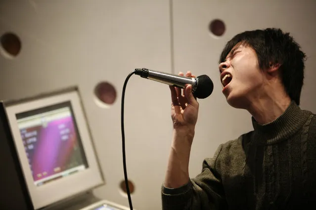 A man sings in a local karaoke club during a night out in Shanghai. (Photo by Nir Elias/Reuters)
