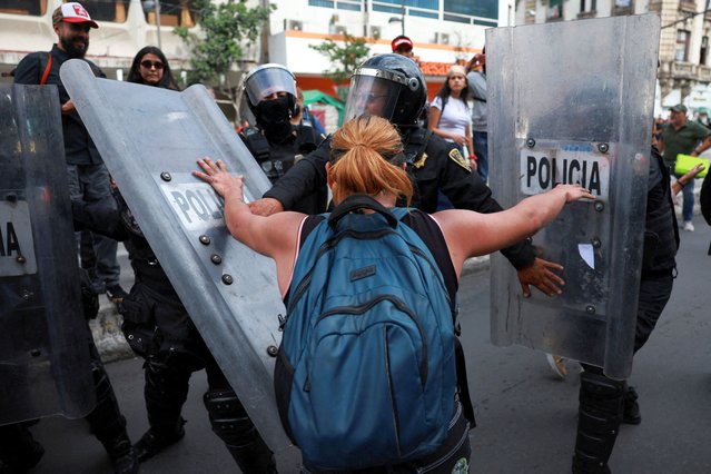 A demonstrator clashes with police officers during a protest against gentrification in Mexico City, Mexico on July 26, 2025. (Photo by Henry Romero/Reuters)