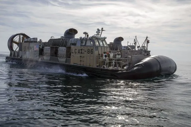 In this image provided by the U.S. Navy, sailors assigned to Assault Craft Unit (ACU) Four operate landing craft air cushions (LCAC) during recovery efforts of debris from a Chinese high altitude balloon in the Atlantic Ocean, off the coast of Myrtle Beach, S.C., on February 8, 2023. (Photo by Eric Moser/U.S. Navy via AP)