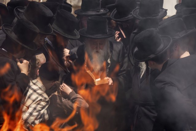 Ultra-Orthodox Jews burn leavened items in final preparation for the Passover holiday in Bnei Brak, near Tel Aviv, Israel, April 22, 2024. (Photo by Oded Balilty/AP Photo)