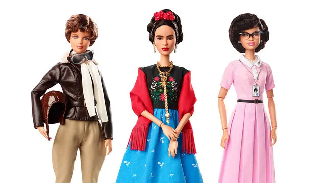 This product image released by Barbie shows dolls in the image of pilot Amelia Earhart, left, Mexican artist Frida Kahlo and mathematician Katherine Johnson, part of the Inspiring Women doll line series being launched ahead of International Women’s Day. (Photo by Barbie via AP Photo)