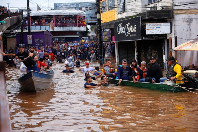 People are rescued after floods in Canoas, at the Rio Grande do Sul state, Brazil, on May 5, 2024. (Photo by Amanda Perobelli/Reuters)