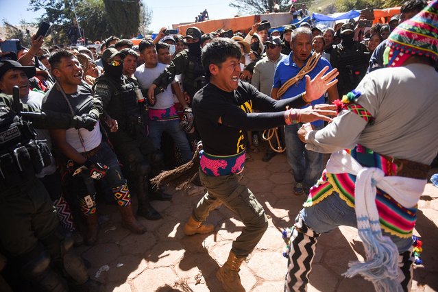 Indigenous men fight during the Quechua Tinku ritual in San Pedro de Macha, north of Potosi, Bolivia on May 4, 2024. (Photo by Claudia Morales/Reuters)