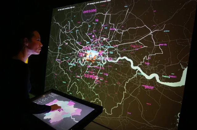 A staff member interacts with a live social media map of London at the Big Bang Data exhibition at Somerset House on December 2, 2015 in London, England. (Photo by Peter Macdiarmid/Getty Images for Somerset House)