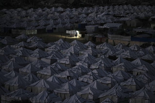 A tent camp housing displaced Palestinians stretches across Gaza City, Sunday, November 30, 2025. (Photo by Jehad Alshrafi/AP Photo)