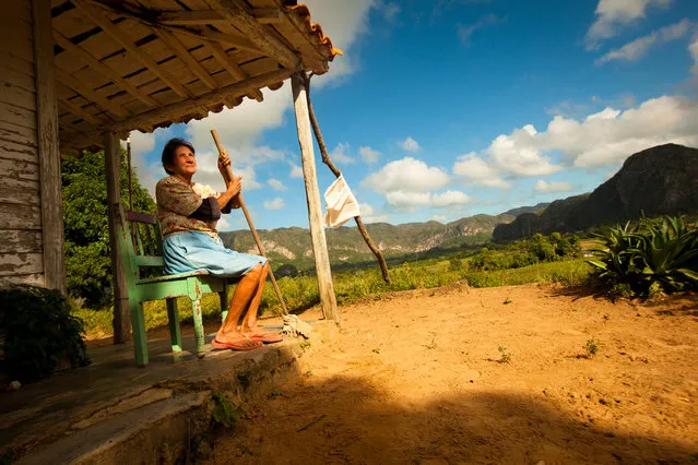 “Devotion to the Land”. Dora and her husband are farmers living in the ancient valley of Vinales in northwest Cuba. This valley is studded with ancient limestone pillars called mogotes that stand like guardians over the fertile fields of tobacco and corn. (Photo and caption by James Kao/National Geographic Traveler Photo Contest)