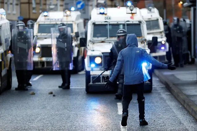 A rioter reacts towards the police on the Springfield Road as protests continue in Belfast, Northern Ireland on April 8, 2021. (Photo by Jason Cairnduff/Reuters)