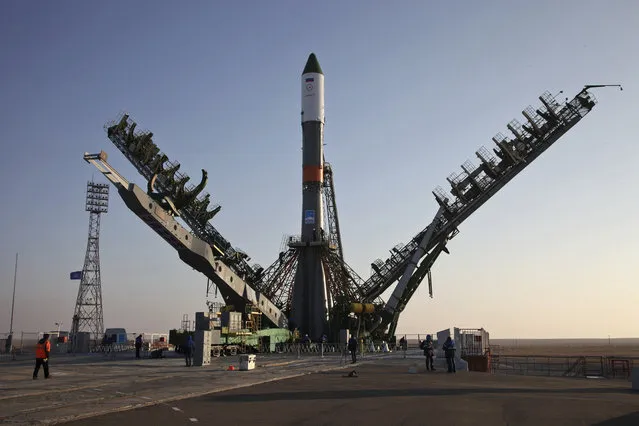 In this photo dated Tuesday, November 29, 2016 the Soyuz-FG rocket booster with the Progress MS-04 cargo ship is installed on a launch pad in Baikonur, Kazakhstan. The unmanned Russian cargo space ship Progress MS-04 broke up in the atmosphere over Siberia on Thursday Dec. 1, 2016,  just minutes after the launch en route to the International Space Station due to an unspecified malfunction, the Russian space agency said. (Photo by Oleg Urusov/Roscosmos Space Agency Press Service photo via AP Photo)