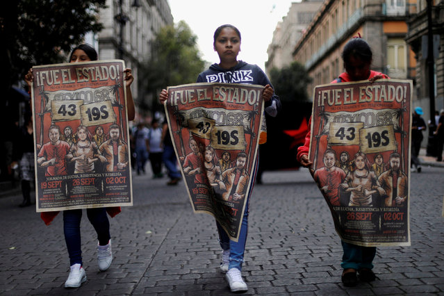 Demonstrators take part during a march marking the 50th anniversary of the 1968 student massacre by Mexican armed forces In Mexico City, Mexico October 2, 2018. (Photo by Edgard Garrido/Reuters)