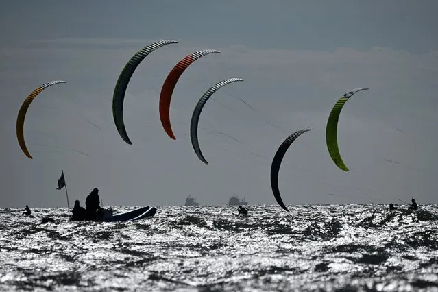 Competitors race during the final day of the 2023 Formula Kite European Championships, in Portsmouth, southern England, on September 24, 2023. (Photo by Justin Tallis/AFP Photo)