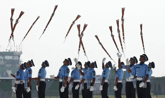 Soldiers from an Indian Air Force Drill Team present their skills during the Indian Air Force Day celebrations at the Air Force base in Allahabad, Uttar Pradesh, India, 08 October 2023. The Indian Air Force celebrates its 91st anniversary. (Photo by Rajat Gupta/EPA)