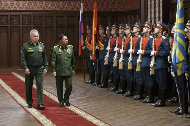 Russian Defense Minister Sergei Shoigu, left, and Commander-in-Chief of Myanmar's armed forces, Senior General Min Aung Hlaing walk past the honor guard prior to their talks in Moscow, Russia, Tuesday, June 22, 2021. (Photo by Vadim Savitskiy/Russian Defense Ministry Press Service via AP Photo)