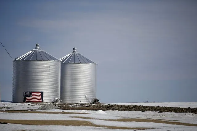 A U.S. flag is seen on the side of grain silo in Marshalltown, Iowa, March 8, 2015. (Photo by Jim Young/Reuters)