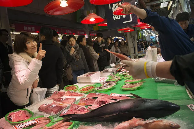 Fresh seafood and produce are found at the Omi-Cho market in Kanazawa, Japan on January 8, 2016. Kanazawa is known for sushi and patrons to Omicho can have it served to them while they shop. Shoppers can pick out seafood and in some shops, have it grilled for them to consume on the spot. (Photo by Linda Davidson/The Washington Post)