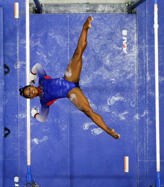 Simone Biles competes on the uneven bars during the U.S. Women's Olympic Gymnastics trials in St Louis, Missouri, June 25, 2021. (Photo by Lindsey Wasson/Reuters)