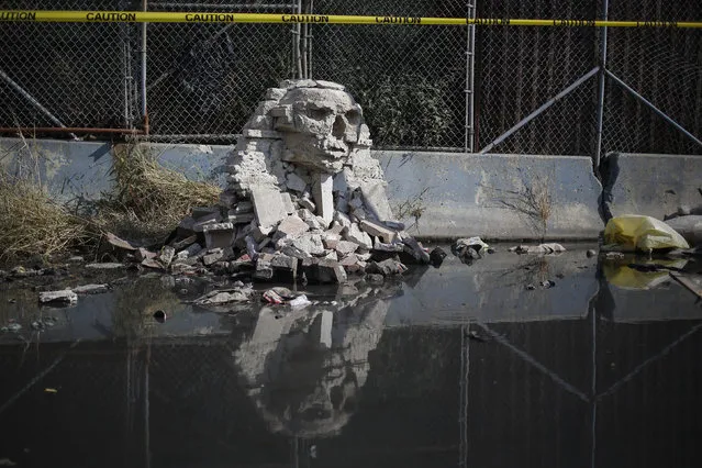 A rock formation by British graffiti artist Banksy is seen in the Queens borough of New York October 22, 2013. (Photo by Shannon Stapleton/Reuters)