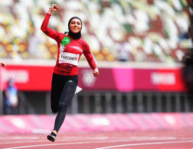 Fasihi Farzaneh of Team Iran reacts after qualifying for the next round after her performance during the Women's 100 meter preliminary round on day seven of the Tokyo 2020 Olympic Games at Olympic Stadium on July 30, 2021 in Tokyo, Japan. (Photo by Aleksandra Szmigiel/Reuters)