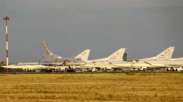 In this photo released by Russian Defense Ministry Press Service, one Russian Tu-22M3 long-range bomber rolls preparing for its takeoff at the Termez firing range in Uzbekistan, Friday, August 6, 2021. On Friday, Russian and Uzbek troops wrapped up joint war games involving 1,500 troops and 200 military vehicles who practiced action to destroy militants. The maneuvers featured Russian Tu-22M3 long-range bombers hitting mock targets representing militant camps at the Termez firing range in Uzbekistan. (Photo by Russian Defense Ministry Press Service via AP Photo)