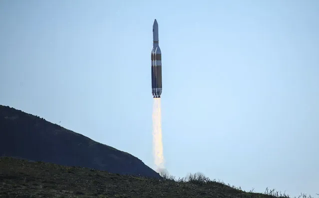 A powerful Delta 4 Heavy rocket carrying a U.S. spy satellite lifts off from Vandenberg Air Force Base in Calif., Saturday, January 19, 2019. The rocket propelled the National Reconnaissance Office satellite at 11:10 a.m. Pacific time, arcing over the Pacific Ocean west of Los Angeles as it headed toward space. The United Launch Alliance Delta 4 Heavy is made up of 3 rocket cores strapped together producing almost 2.2 million pounds of thrust at lift-off. (Photo by Matt Hartman/AP Photo)