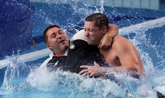 Sava Randelovic of Team Serbia pushes a support staff member into the pool to celebrate during the Men's Gold Medal match between Greece and Serbia on day sixteen of the Tokyo 2020 Olympic Games at Tatsumi Water Polo Centre on August 08, 2021 in Tokyo, Japan. (Photo by Maddie Meyer/Getty Images)