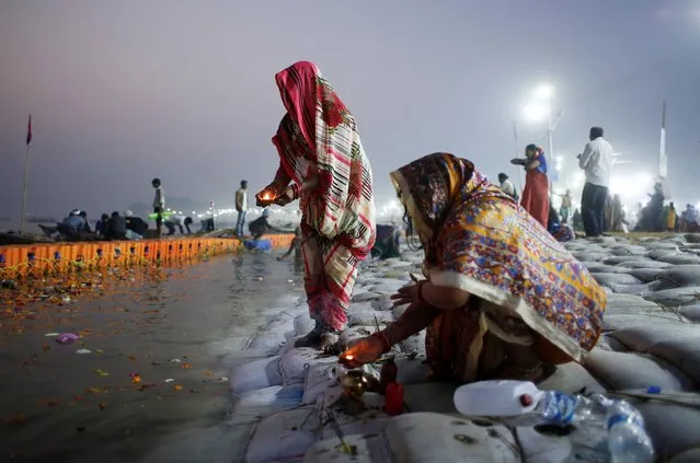 Devotees pray on the banks of the river Ganges during “Kumbh Mela”, or the Pitcher Festival, in Prayagraj, previously known as Allahabad, India, February 2, 2019. Picture taken February 2, 2019. (Photo by Adnan Abidi/Reuters)