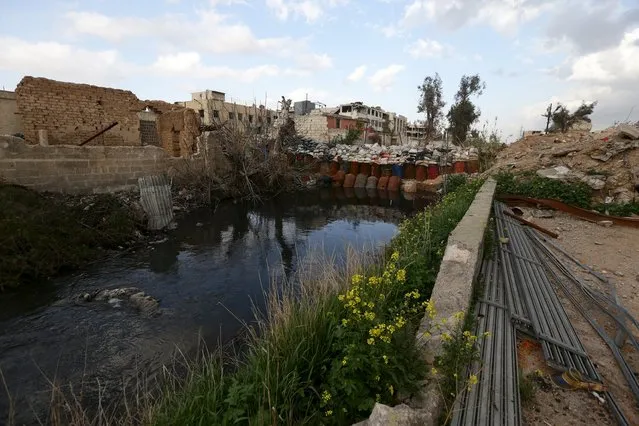 Sandbags are used for a barrier in Toura river in the rebel-controlled area of Jobar, a suburb of Damascus, Syria March 3, 2016. (Photo by Bassam Khabieh/Reuters)