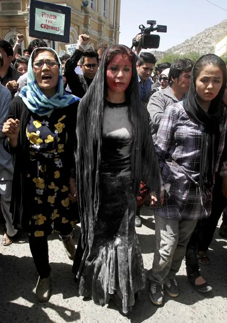 Afghan women chant slogans during a protest demanding justice for a woman who was beaten to death by a mob after being falsely accused of burning a Quran more than one month ago, in downtown Kabul, Afghanistan, Monday, April 27, 2015. (Photo by Allauddin Khan/AP Photo)