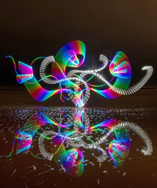 Kevin Jay paints with light using colourful LED lights on the beach at Clacton-on-Sea in Essex, UK during a 59-second exposure on January 12, 2024. (Photo by Kevin Jay/Picture Exclusive)
