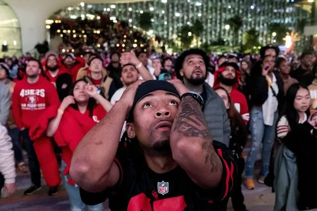San Francisco 49ers fans react during overtime play while watching a telecast of NFL football's Super Bowl 58 on a screen outside the Chase Center in San Francisco on Sunday, February 11, 2024. (Photo by Noah Berger/AP Photo)