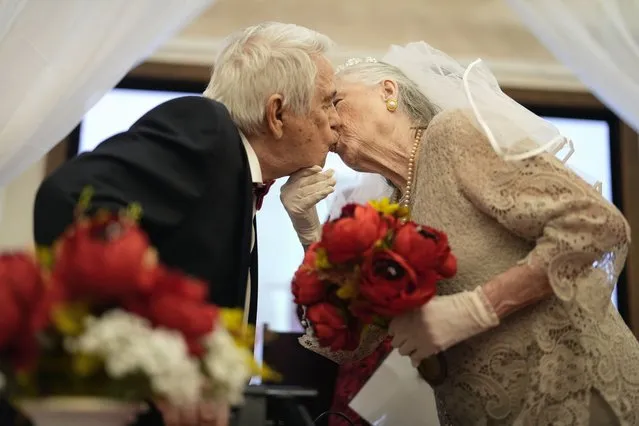 Linda Kalayci, right, kisses her husband of 57 years, Tanzer Kalayci, after they renewed their vows during a Valentine's Day ceremony at the Memory Care center where Tanzer resides, in the Palace at Weston senior living community, Wednesday, February 14, 2024, in Weston, Fla. (Photo by Rebecca Blackwell/AP Photo)