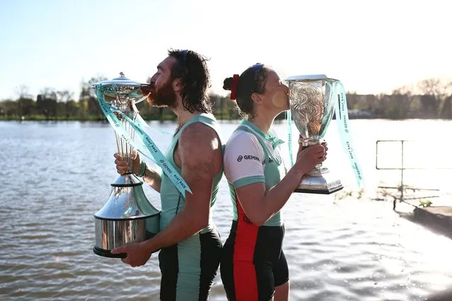 Cambridge University women's team president Jenna Armstrong and men's team president Sebastian Benzecry pose with their trophies after winning the boat race against Oxford University on the River Thames in London on March 30, 2024. The Boat Race was first raced by crews from Oxford and Cambridge University in 1829 and is now one of the world's oldest and most famous amateur sporting events. (Photo by Henry Nicholls/AFP Photo)