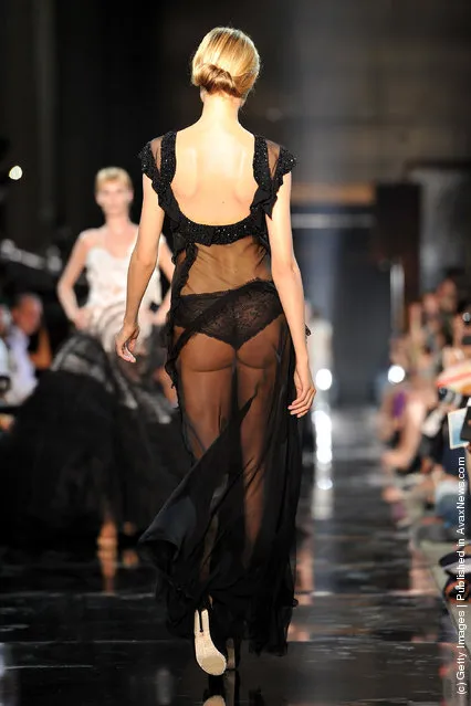 A model walks the runway during the John Galliano Ready to Wear Spring / Summer 2012 show during Paris Fashion Week
