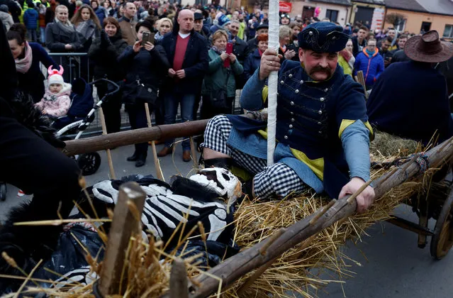 Revellers take part in a traditional event marking the last day of the carnival season called “Kusaki”, a folk party and a re-enactment showing the “defeat of Death” where all roles are played by males, takes place during Shrove Tuesday in the village of Jedlinsk near Radom, Poland February 28, 2017. (Photo by Kacper Pempel/Reuters)