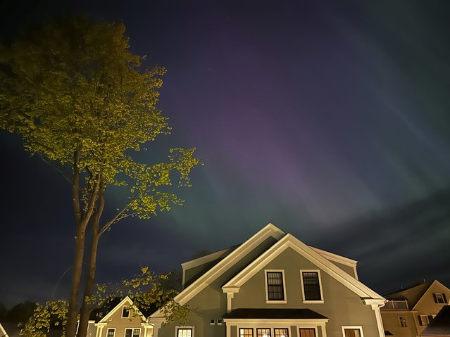 Northern lights shine over Portsmouth, N.H., Friday, May 10, 2024. (Photo by Caleb Jones/AP Photo)