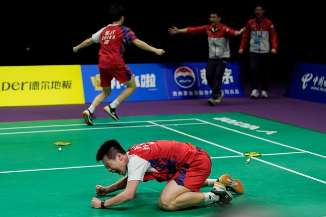 China’s He Jiting (L) and Ren Xiangyu celebrate after winning against Indonesia’s Muhammad Shohibul Fikri and Bagas Maulana at their men’s doubles final match in the Thomas and Uber Cup badminton tournament of Chengdu, in China’s southwest Sichuan province on May 5, 2024. (Photo by Ng Han Guan/AP Photo)
