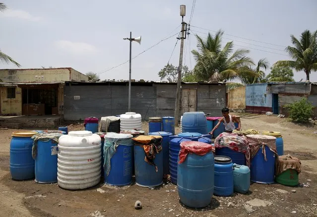 Containers belonging to residents filled with water are seen in Masurdi village, in Latur, India, April 16, 2016. (Photo by Danish Siddiqui/Reuters)