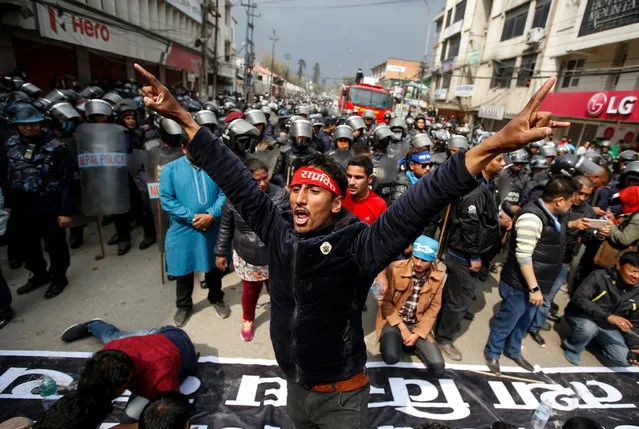 Activists of Rastriya Prajatantra Party (RPP) shout anti election commission slogan during a protest in Kathmandu, Nepal, 20 March 2017. Hundreds of RPP activists staged protest rally after election commission didn't allow them to enter in upcoming local election with their party agenda which is Monarchy System and Nepal as a Hindu state. The government of Nepal has announced local level elections on 14 May 2017, the first in 20 years. (Photo by Narendra Shrestha/EPA)