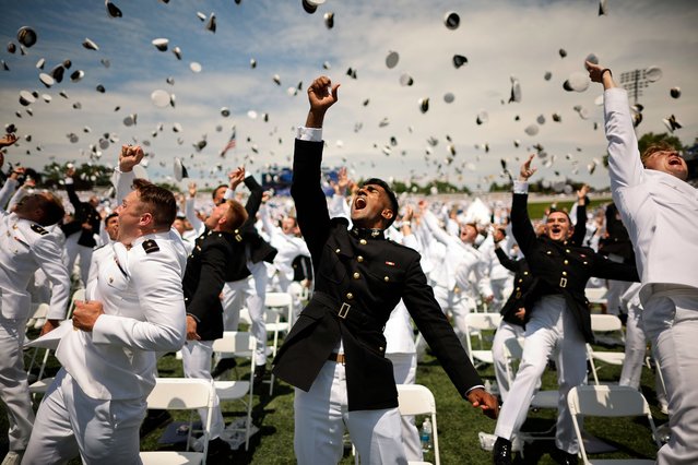 U.S. Naval Academy graduates throw their hats into the air at the conclusion of their graduation ceremony at the Navy-Marine Corps Memorial Stadium at the academy on May 24, 2024 in Annapolis, Maryland. 1040 men and women graduated from the academy and will enter the Navy as ensigns or the Marine Corps as 2nd lieutenants, where they will serve for at least five years. (Photo by Chip Somodevilla/Getty Images)